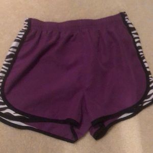 Purple and zebra running shorts.